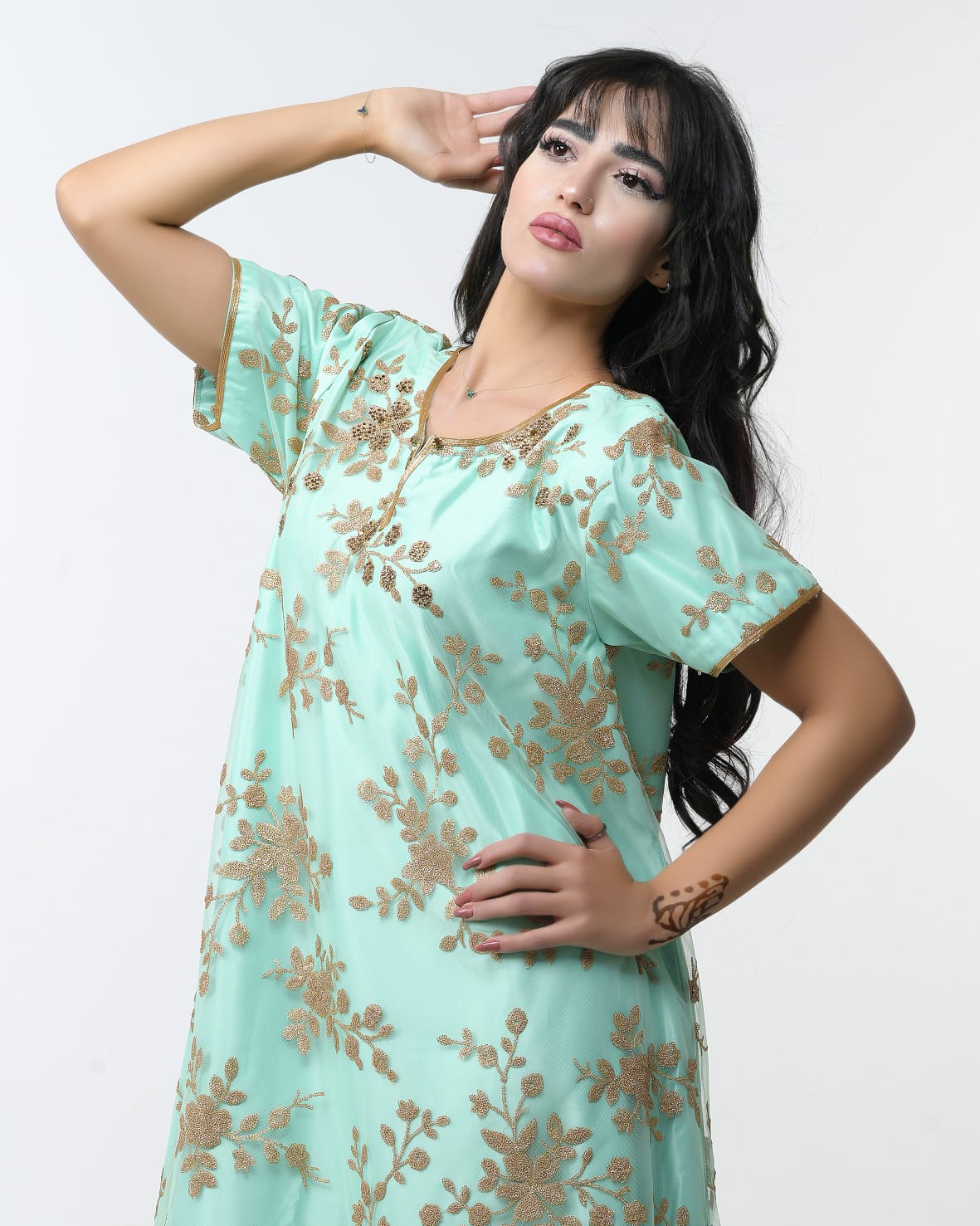 Luxurious Satin dress with Tulle embroidered using golden threads and studded with crystals